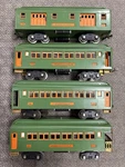 + Lionel Prewar Standard Tinplate Green & Orange 300 Series 4 Car Passenger Set. Fixed Price $599.99.
