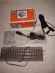 Lionel Gauge Direct Lock-on & Power Adapter. Fixed Price $100.00.